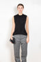 The Tuxedo Top by Meryll Rogge is structured sleeveless top with button detailing on the back and a tuxed band