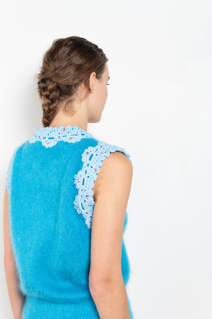 The Crochet Vest by Meryll Rogge is a showstopping runway piece, a sleeveless vest in a blue mohair with embellished crochet details