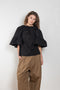 The Workwear Chino by Meryll Rogge is a signature oversized trouser with a drawstring closure