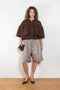 The Ruffle Tiered Top by Meryll Rogge is a crisp cotton top with layered ruffles that can be tucked into your trousers