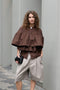 The Ruffle Tiered Top by Meryll Rogge is a crisp cotton top with layered ruffles that can be tucked into your trousers