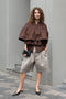 The Ruffle Tiered Top by Meryll Rogge is a crisp cotton top with layered ruffles that can be tucked into your trousers