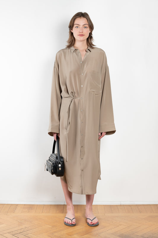 The 10.4 Dress by Monique Van Heist is a loose silk dress that can be tied at the waist
