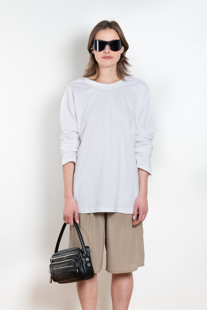 The TShirt 1990 by Monique Van Heist is a loose fitted lightweight sweat tshirt with a delicate open back detail