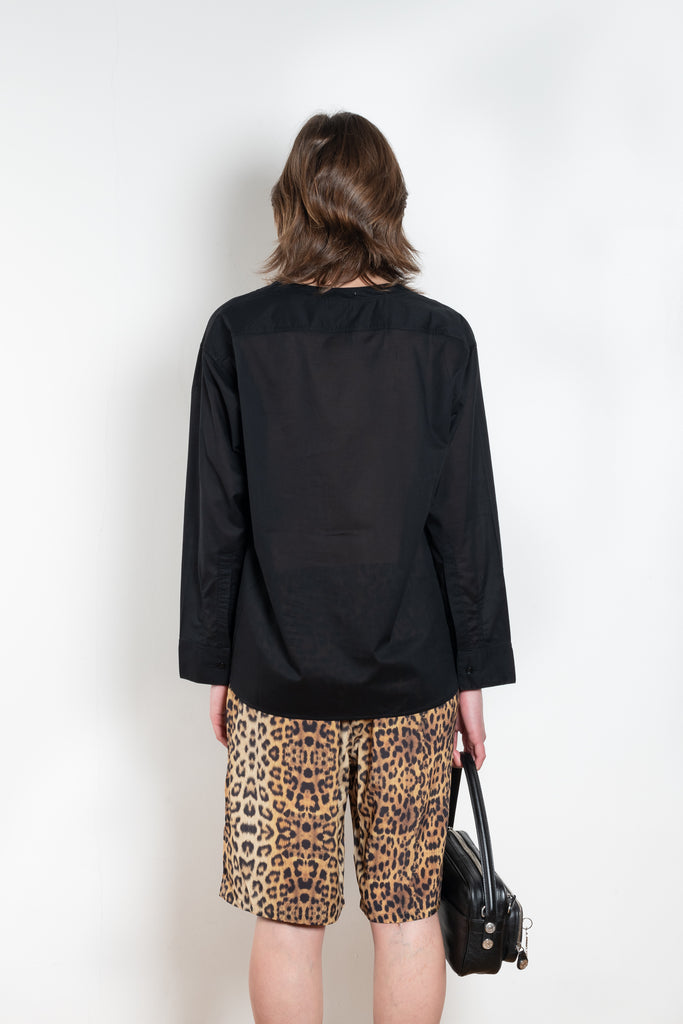 The V Shirt by Monique Van Heist is a loose fitted shirt with baseball inspired details