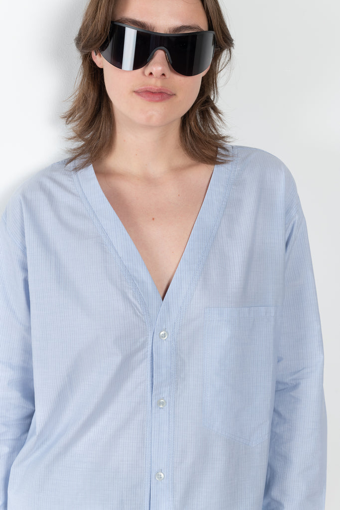 The V Shirt by Monique Van Heist is a loose fitted shirt with baseball inspired details