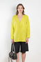 The V Shirt by Monique Van Heist is a loose fitted shirt with baseball inspired details