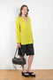 The V Shirt by Monique Van Heist is a loose fitted shirt with baseball inspired details
