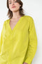 The V Shirt by Monique Van Heist is a loose fitted shirt with baseball inspired details