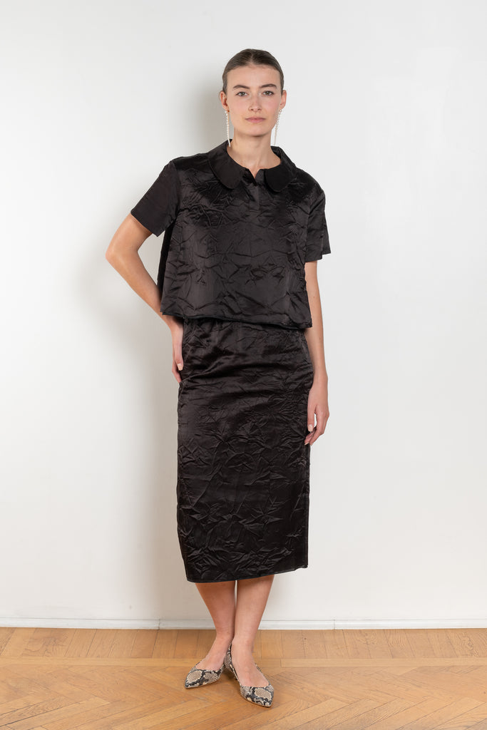 The Crayon Skirt by Nackiye is a knee length pencil skirt with raw edging and a slight noir petticoat reveal.