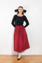 The Dancer Knit Top by Nackiye is a fine rib top with an open back and grosgrain bow ties on the back