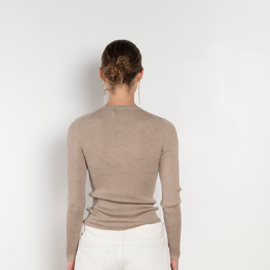 The Insider Knit Top by Nackiye is a classic button down knit top. The insider is close fitting in a soft, lightweight wool & silk, has a rounded v neckline