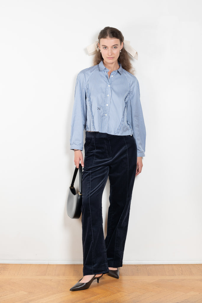 The Moshi Moshi Top by Nackiye is a buttoned up tailored shirt with front and back ruffles