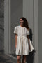 The Peony Dress by Nackiye is a sweet short babydoll inspired dress with a detachable collar detail and an pearl pin embellishment