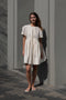 The Peony Dress by Nackiye is a sweet short babydoll inspired dress with a detachable collar detail and an pearl pin embellishment