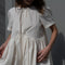 The Peony Dress by Nackiye is a sweet short babydoll inspired dress with a detachable collar detail and an pearl pin embellishment