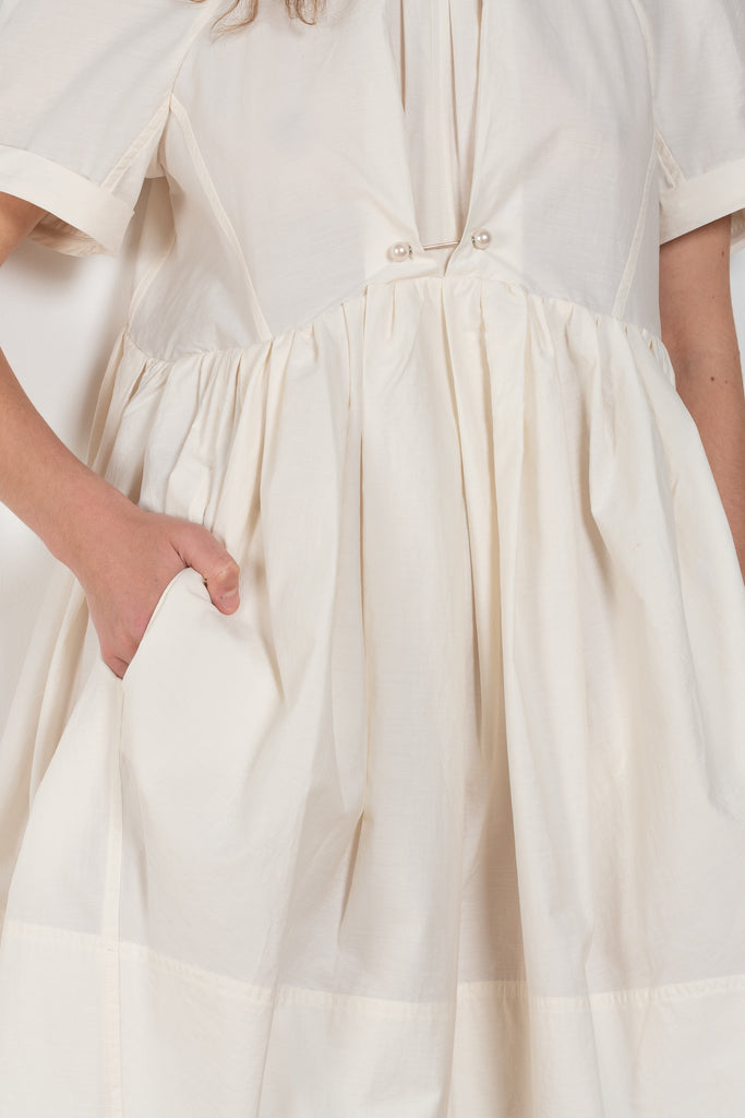 The Peony Dress by Nackiye is a sweet short babydoll inspired dress with a detachable collar detail and an pearl pin embellishment