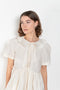 The Peony Dress by Nackiye is a sweet short babydoll inspired dress with a detachable collar detail and an pearl pin embellishment