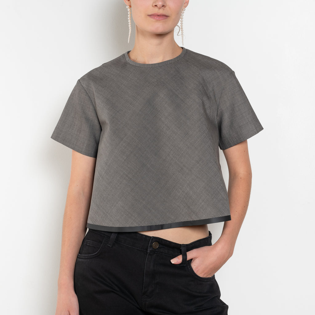 The Pixie Top by Nackiye is a fresh take on the classic shirt. Sleek A-line silhouette, short sleeves & a detachable back belt