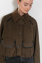 The Precious Cargo Jacket by Nackiye is a parka jacket with hand draped semi attached voluminous pockets and a leather collar