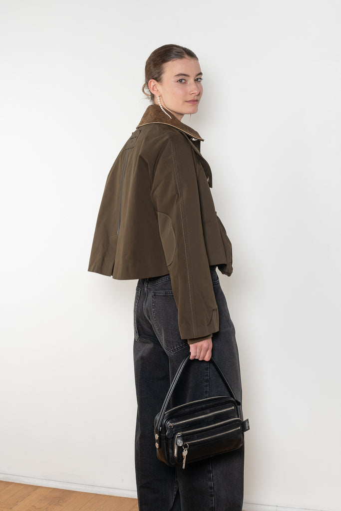 The Precious Cargo Jacket by Nackiye is a parka jacket with hand draped semi attached voluminous pockets and a leather collar