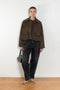 The Precious Cargo Jacket by Nackiye is a parka jacket with hand draped semi attached voluminous pockets and a leather collar