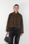 The Precious Cargo Jacket by Nackiye is a parka jacket with hand draped semi attached voluminous pockets and a leather collar