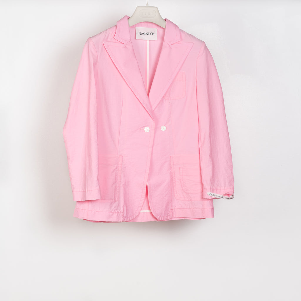 The Second Skin Jacket by Nackiye is a fitted tailored shirt jacket in a bright candy pink cotton blend