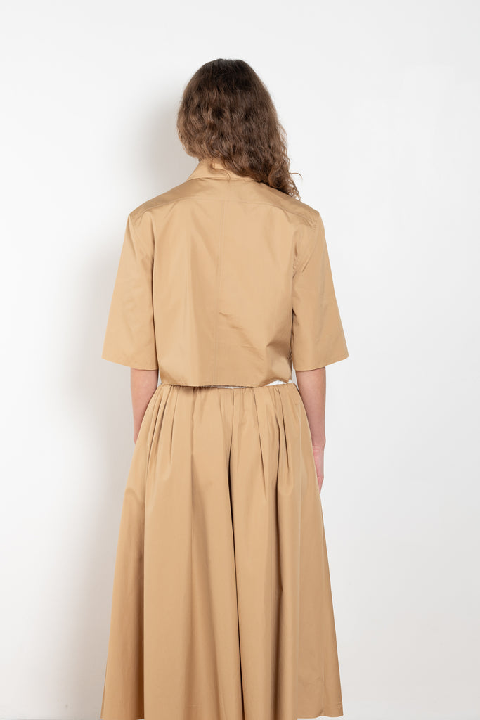 The Shortcut Shirt by Nackiye is a crop shirt with pointy collar and faux front pockets. 