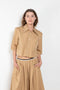 The Shortcut Shirt by Nackiye is a crop shirt with pointy collar and faux front pockets. 