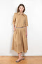 The Shortcut Shirt by Nackiye is a crop shirt with pointy collar and faux front pockets. 