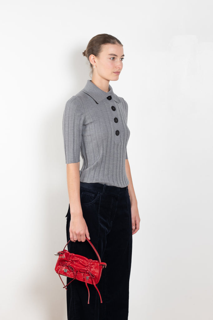 The Sugarman Polo by Nackiye is a fine knit polo with mother of pearl buttons