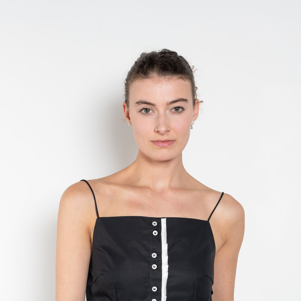 The Surf Rider Top by Nackiye is a delicate strappy top in cotton with a ruffle hem