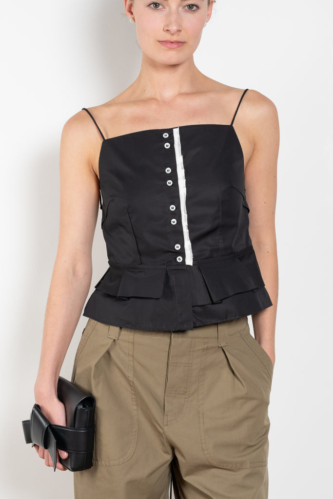 The Surf Rider Top by Nackiye is a delicate strappy top in cotton with a ruffle hem