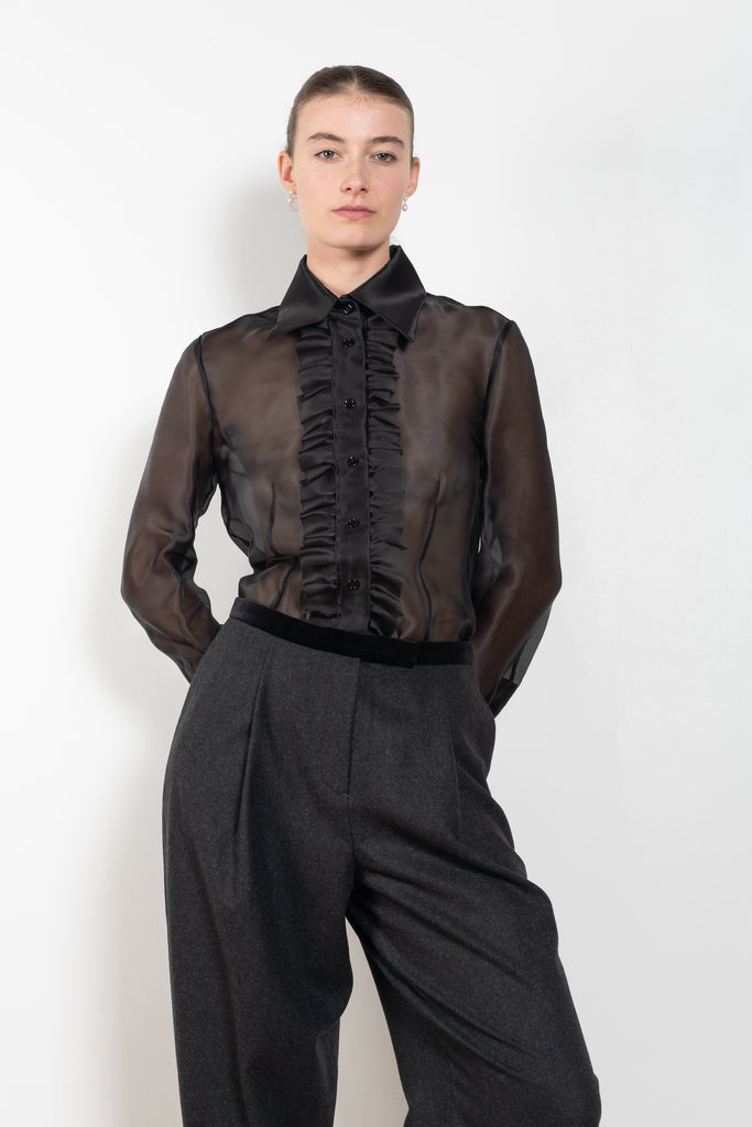 The White Rabbit Top by Nackiye is a silk see-trough shirt with a front ruffle plaquette