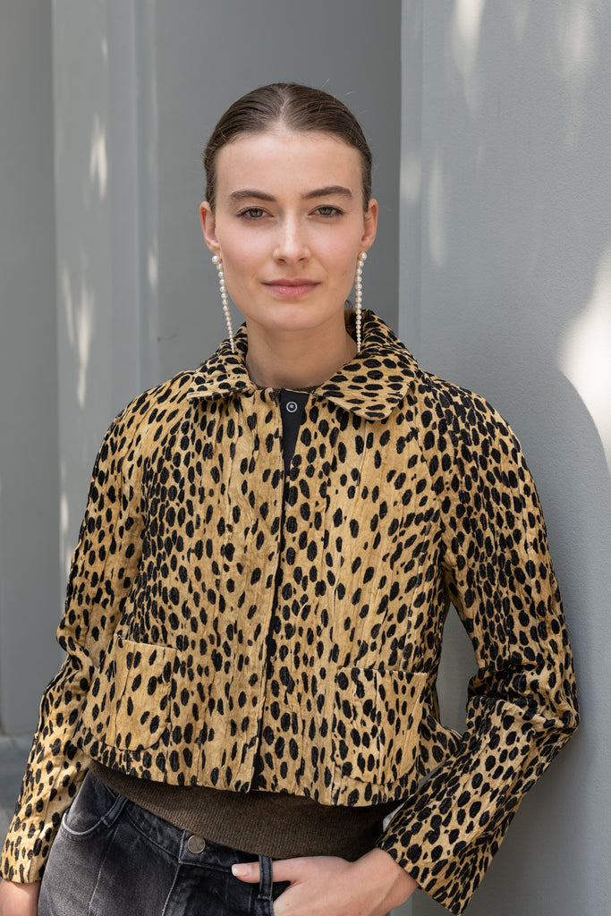 The Pixie Jacket by Nackiye has a cropped silhouette, leopard print & sleeves with two front pockets and elbow patches