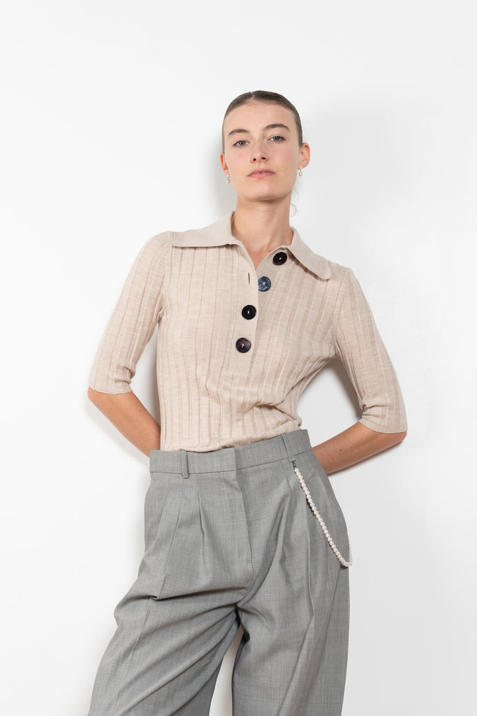 The Sugarman Polo by Nackiye is a fine knit polo with mother of pearl buttons