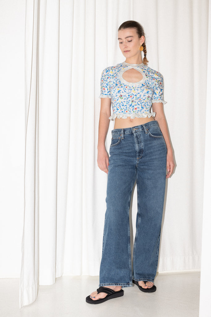 The Floral Cut-out Top by Paco Rabanne is a cropped top in jersey with a front and back cut-out