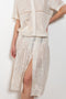 The Ada Skirt by SS Daley is a knee length pleated skirt in a cotton voile with a delicate embroidered print