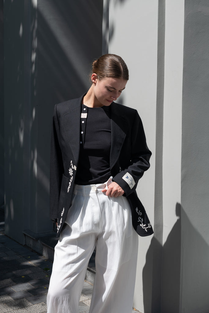 The Orla Trouser by SS Daley is a fluid silk trouser with a wide leg and a sheer hem