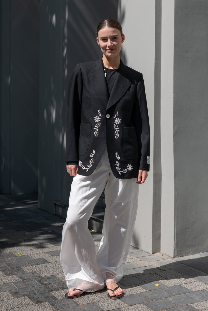 The Orla Trouser by SS Daley is a fluid silk trouser with a wide leg and a sheer hem