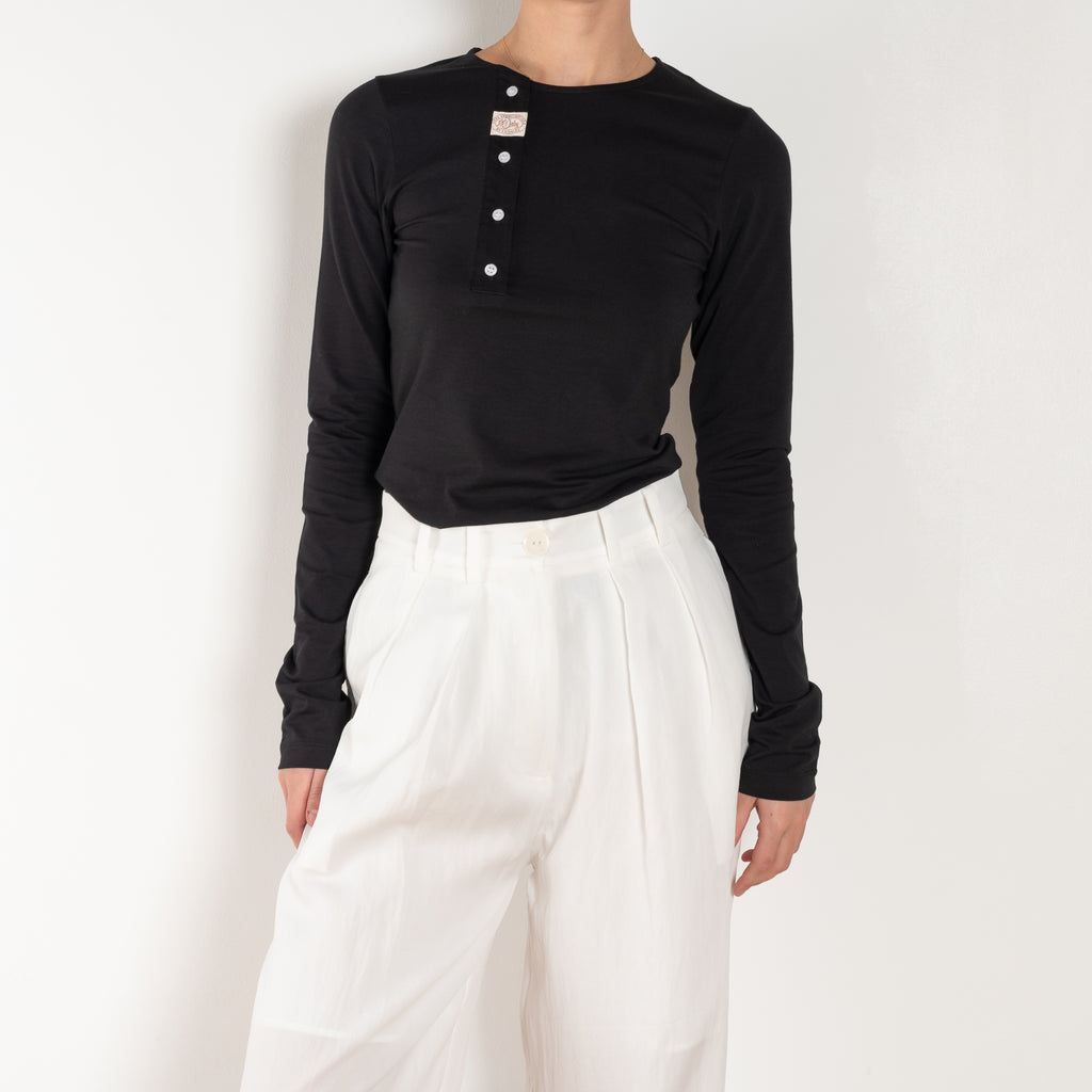 The Orla Trouser by SS Daley is a fluid silk trouser with a wide leg and a sheer hem