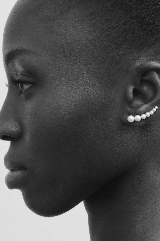 The Boucle De Perle Earrings by Sophie Bille Brahe is a pearl version of Bille Brahe's iconic Croissant de Lune diamond earring