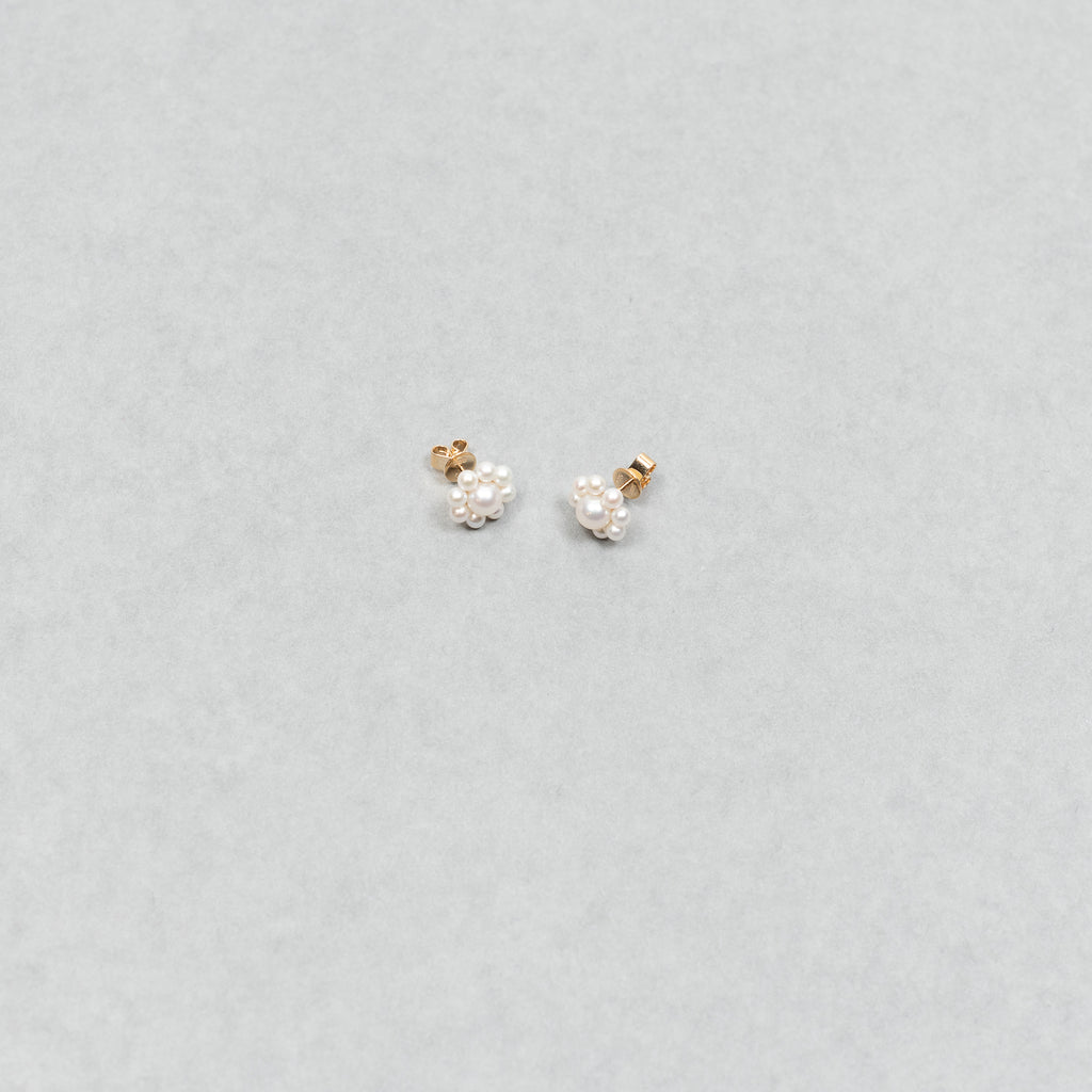 The Margherita Earrings by Sophie Bille Brahe are delicate 14Kt Gold earrings with freshwater pearls arranged to resemble flowers.