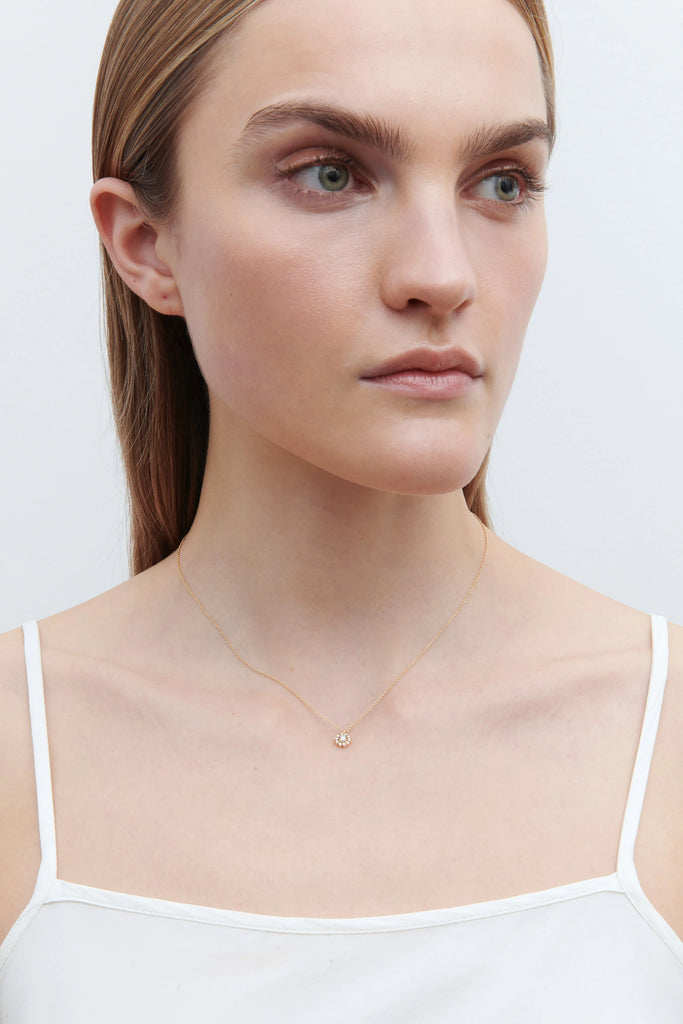 The Soleil Simple Necklace by Sophie Bille Brahe is a delicate necklace featured with a pendant inspired by the sun