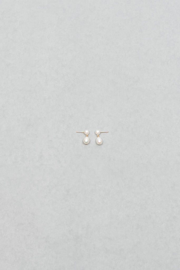 The Venus D'Eau Earrings by Sophie Bille Brahe is a petite pair of pearl earrings featuring a delicate drop shaped pearl dangling from the ear