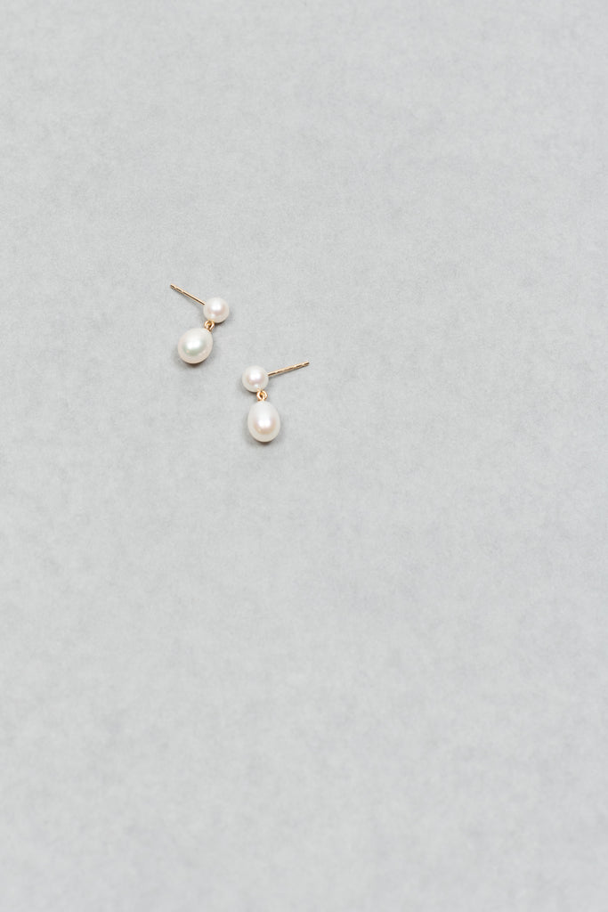 The Venus D'Eau Earrings by Sophie Bille Brahe is a petite pair of pearl earrings featuring a delicate drop shaped pearl dangling from the ear