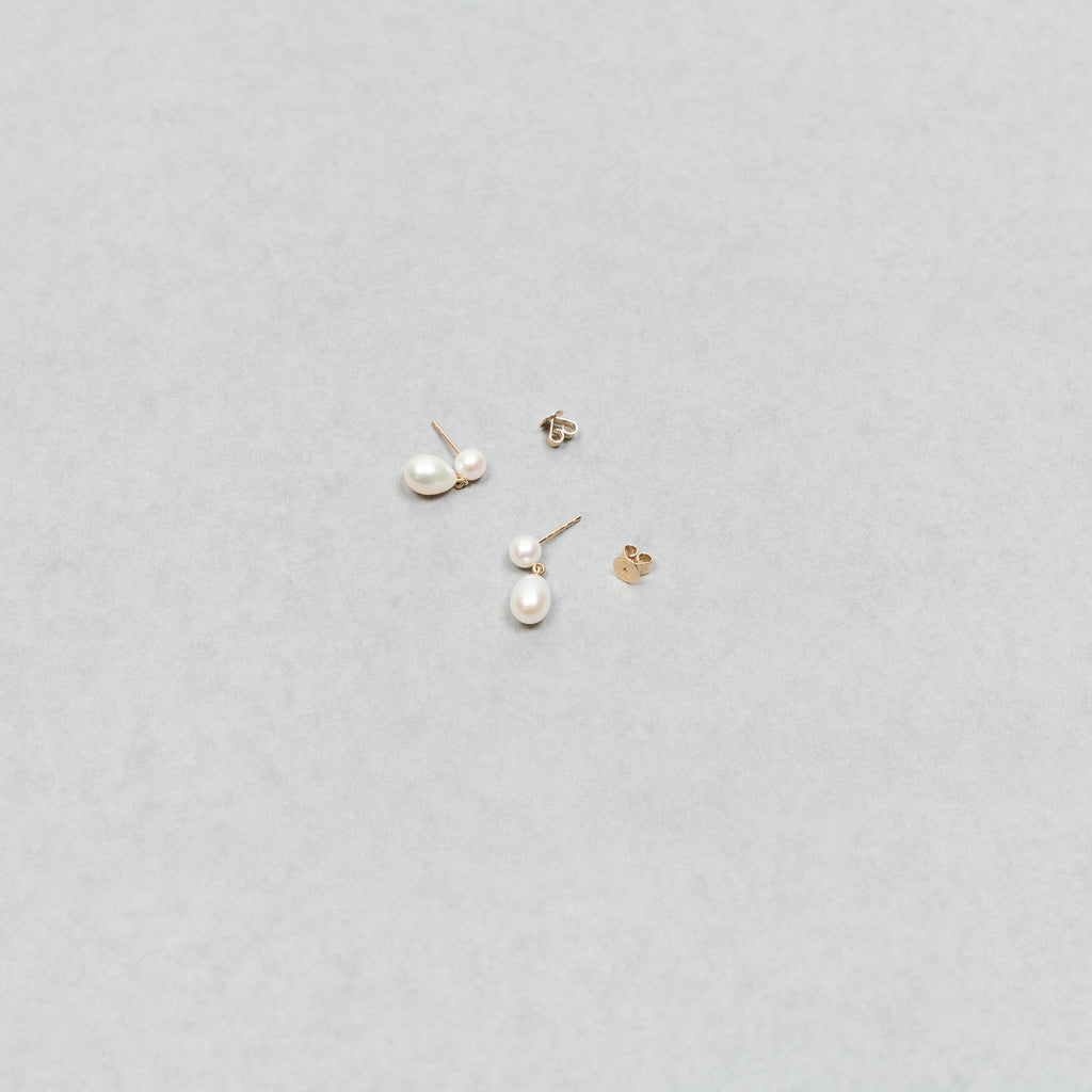 The Venus D'Eau Earrings by Sophie Bille Brahe is a petite pair of pearl earrings featuring a delicate drop shaped pearl dangling from the ear