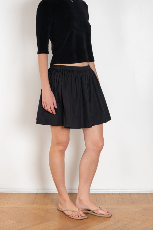 The Fousta Cotton Skirt by Suzie Kondi has an elastic pull-on waist, side pockets, and lightweight fabric
