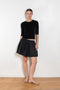 The Fousta Cotton Skirt by Suzie Kondi has an elastic pull-on waist, side pockets, and lightweight fabric